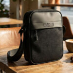 COUNSELOR Textured Sling Bag